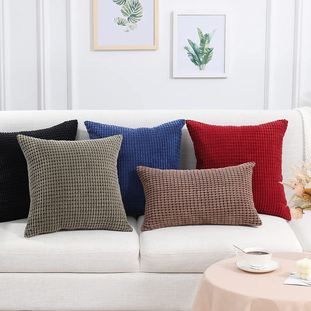 Corduroy Covers - Decorative Pillow in assorted colors including black, blue, red, olive, and brown on a white couch. Soft, textured design ideal for living room decor.
