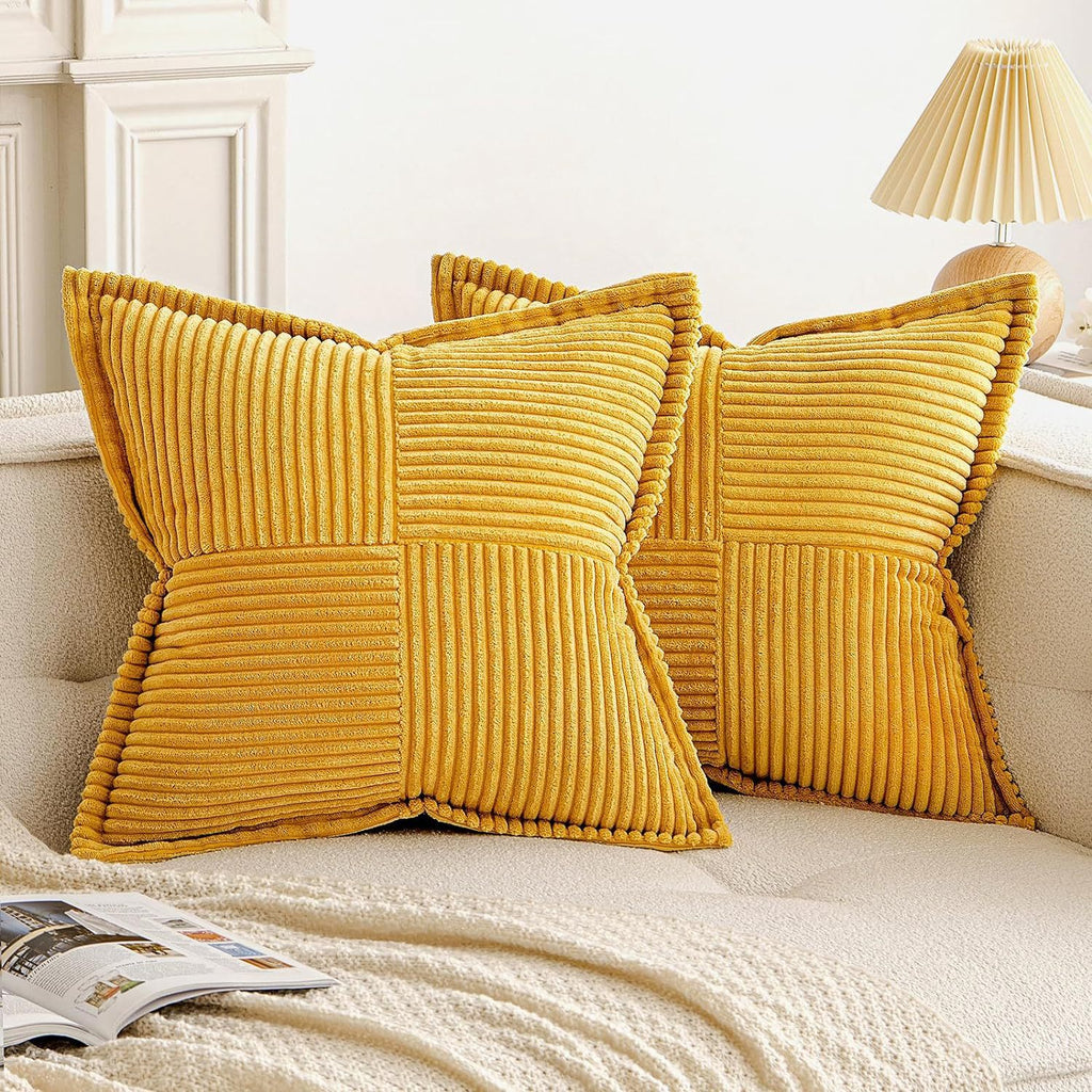 Golden yellow corduroy pillow covers with textured striped design, adding warmth and style to any living room setting.